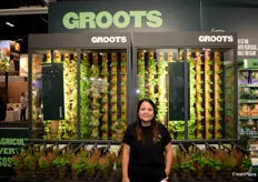 Andrea Aguilar in the booth of Groots, a vertical farm company.
